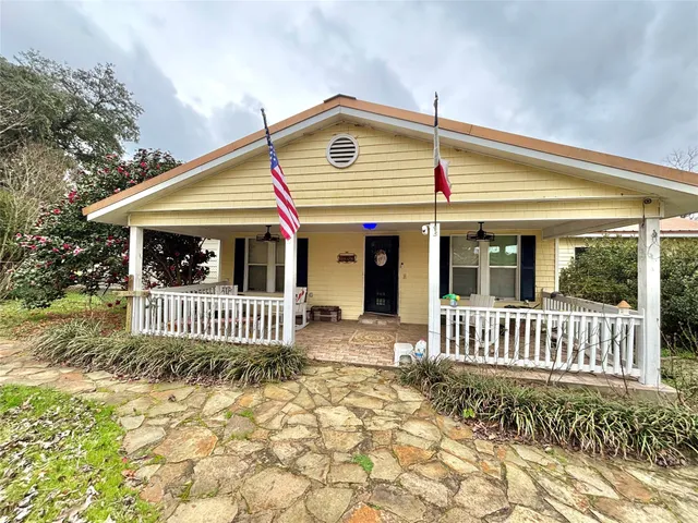 a front view of a house with a porch