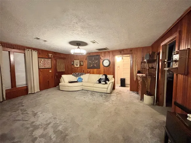 a bedroom with a large bed and a large window