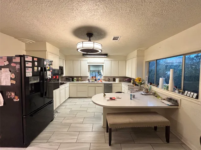 a view of a dining room kitchen and a sink