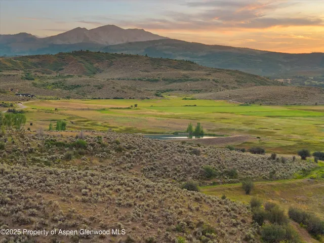 a view of house with outdoor space and garden