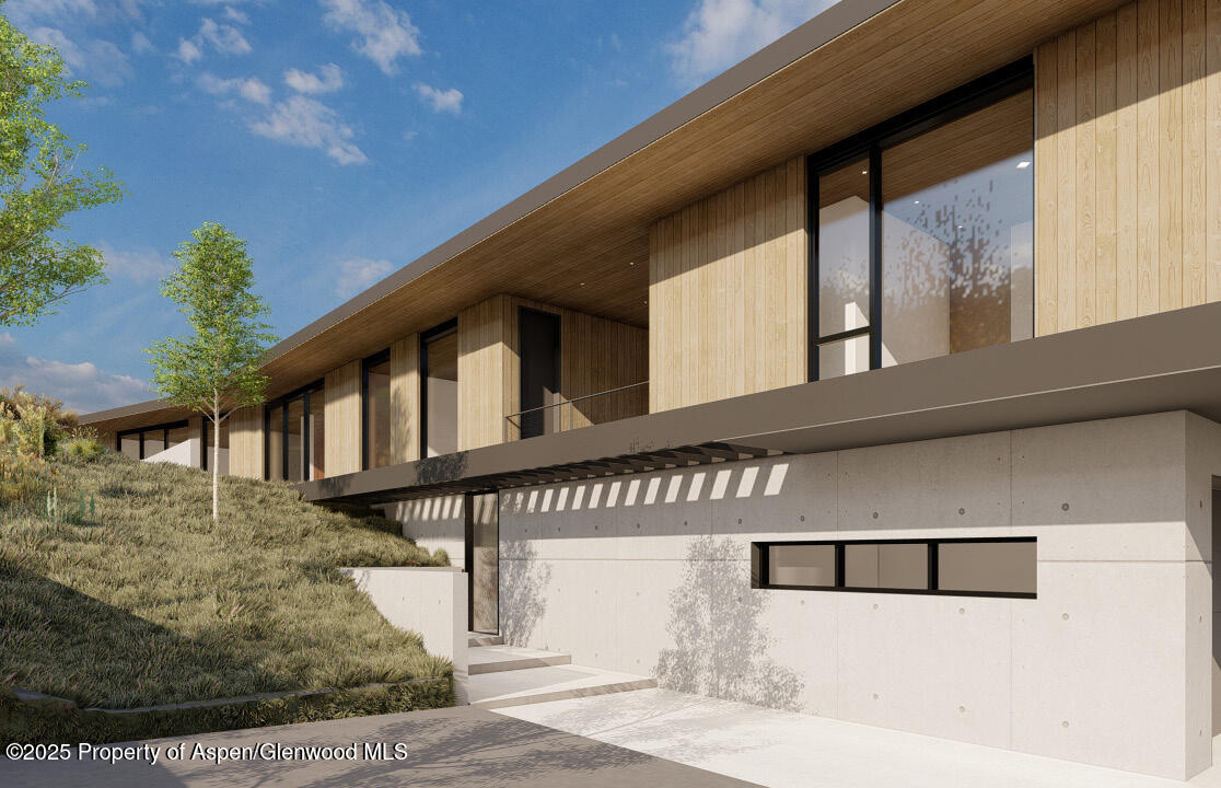 Tbd Lazy O Road Snowmass, CO 81654 - Photo 23 of 44 a front view of a house with a yard