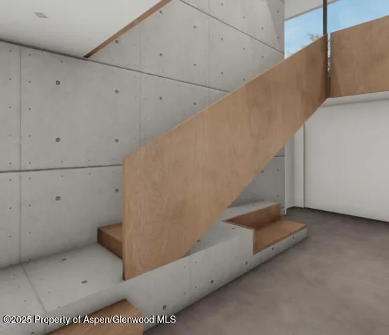 a kitchen with a sink a counter top space and a flat screen tv