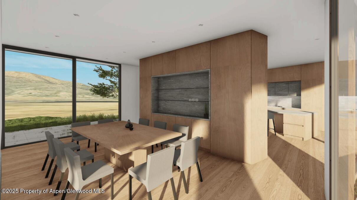 Tbd Lazy O Road Snowmass, CO 81654 - Photo 30 of 44 a dining room with furniture and a floor to ceiling window