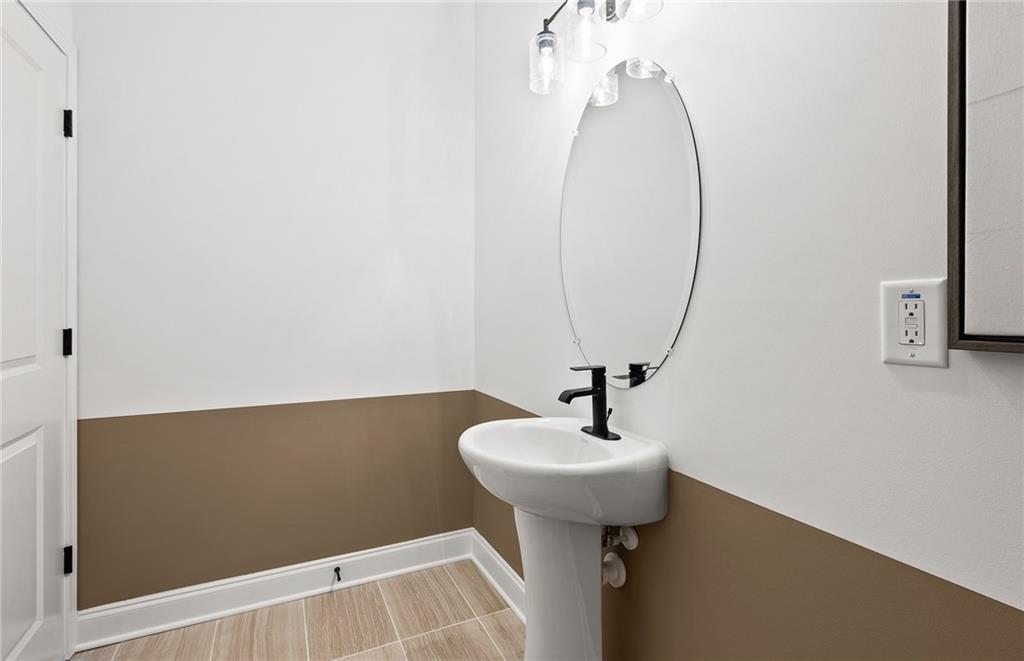 421 Beacon Way Villa Rica, GA 30180 - Photo 15 of 36 a bathroom with a sink and mirror