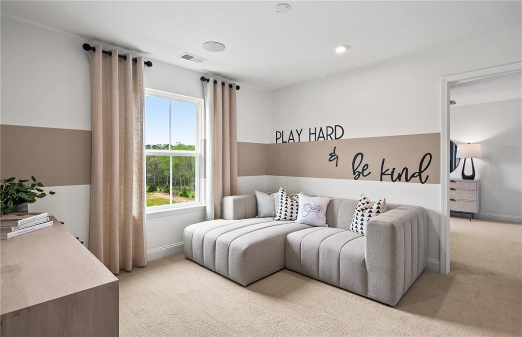 421 Beacon Way Villa Rica, GA 30180 - Photo 20 of 36 a bedroom with a large bed and a couch