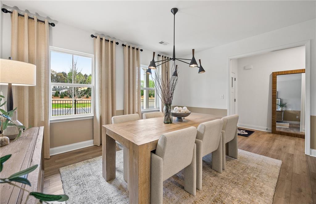 421 Beacon Way Villa Rica, GA 30180 - Photo 2 of 36 a view of a dining room with furniture window and wooden floor