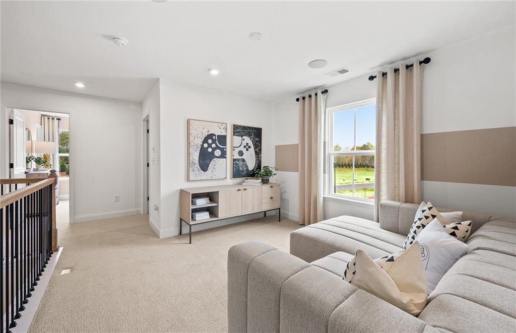 421 Beacon Way Villa Rica, GA 30180 - Photo 21 of 36 a living room with furniture and a large window