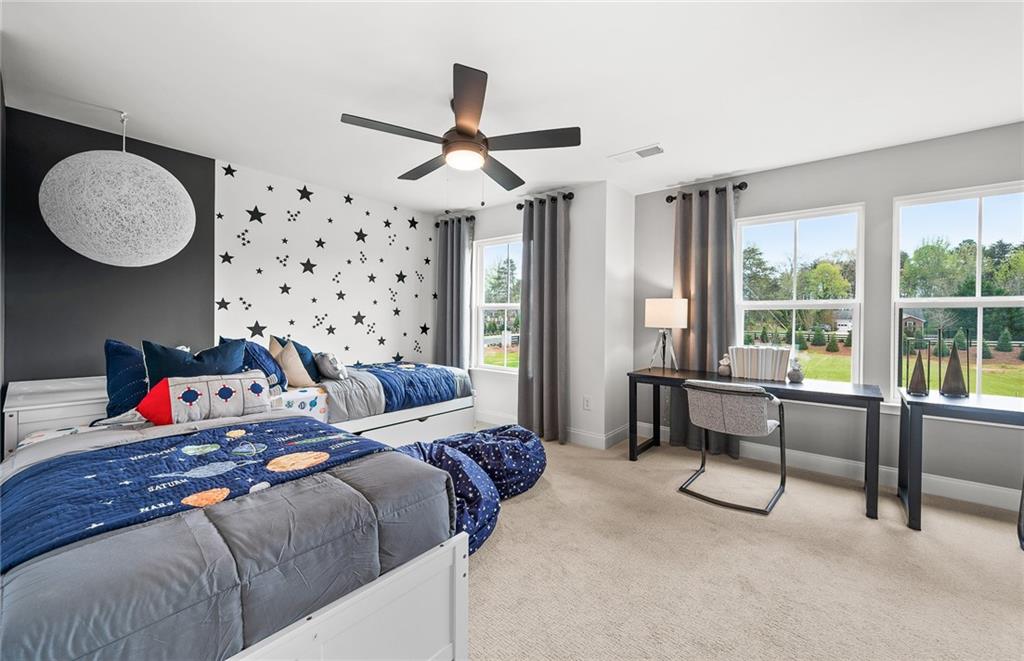 421 Beacon Way Villa Rica, GA 30180 - Photo 27 of 36 a bedroom with bed and a chandelier