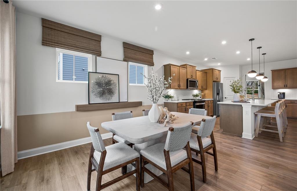 421 Beacon Way Villa Rica, GA 30180 - Photo 10 of 36 a view of a dining room with furniture window and wooden floor
