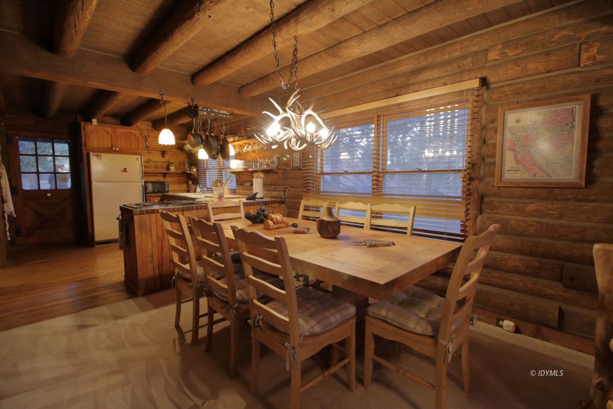 24745 Fern Valley Road Idyllwild, CA 92549 - Photo 13 of 48 a dining room with furniture and wooden floor
