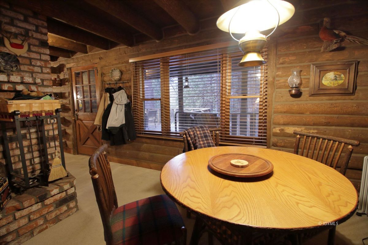24745 Fern Valley Road Idyllwild, CA 92549 - Photo 16 of 48 a view of a dining room with furniture