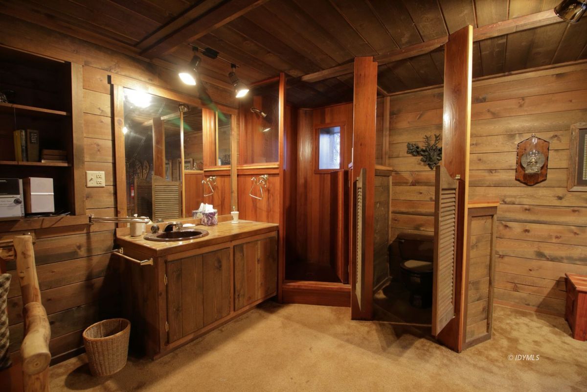 24745 Fern Valley Road Idyllwild, CA 92549 - Photo 25 of 48 a bathroom with a sink a toilet and shower