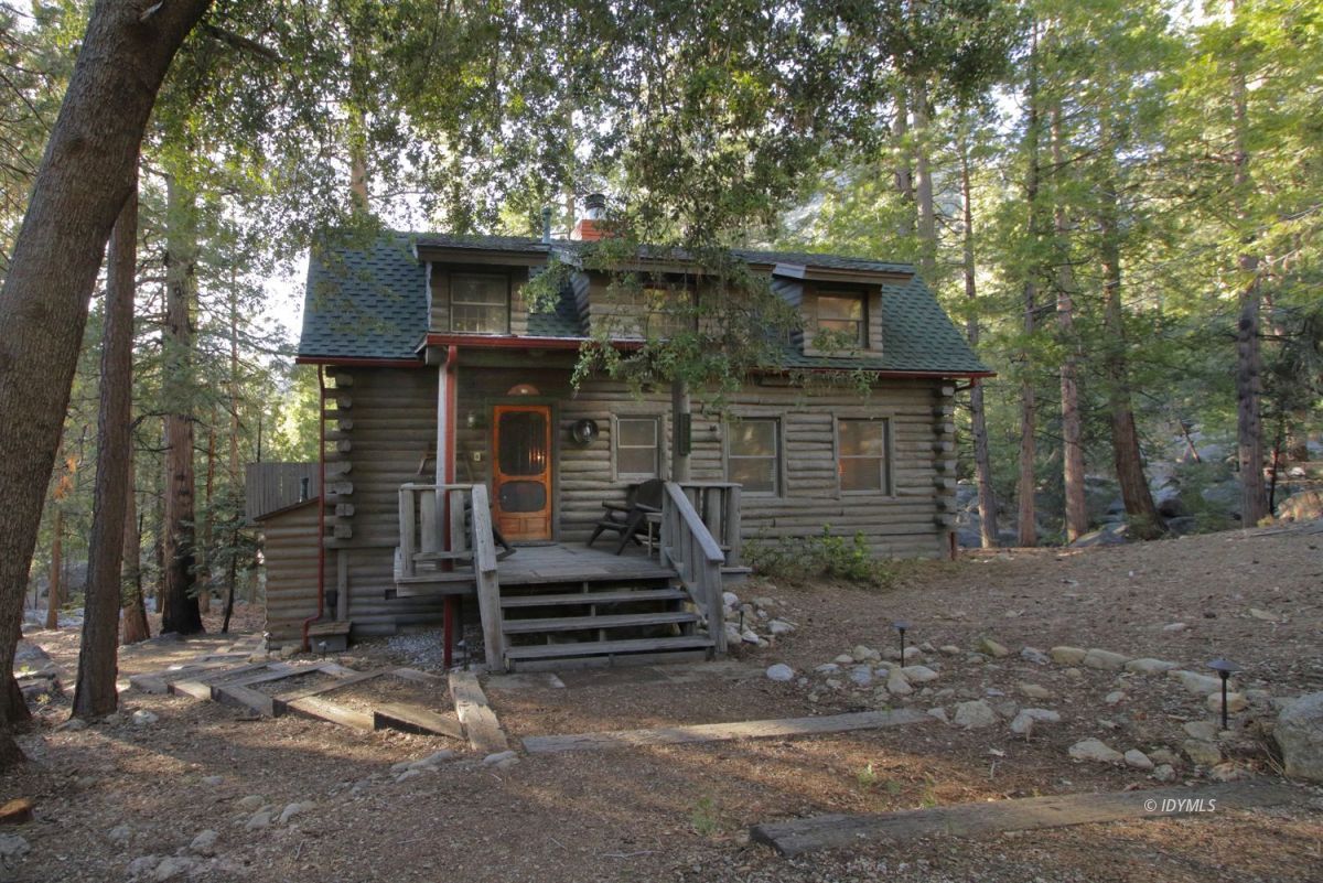 24745 Fern Valley Road Idyllwild, CA 92549 - Photo 3 of 48 a front view of a house with a yard
