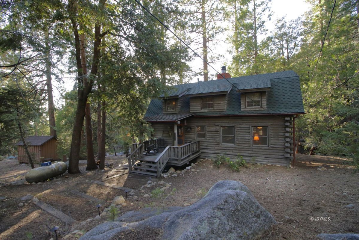 24745 Fern Valley Road Idyllwild, CA 92549 - Photo 31 of 48 a view of a house with backyard and sitting area