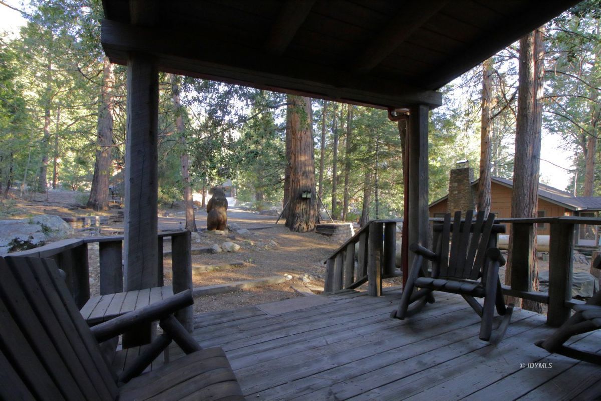 24745 Fern Valley Road Idyllwild, CA 92549 - Photo 34 of 48 a view of a porch with chairs and backyard