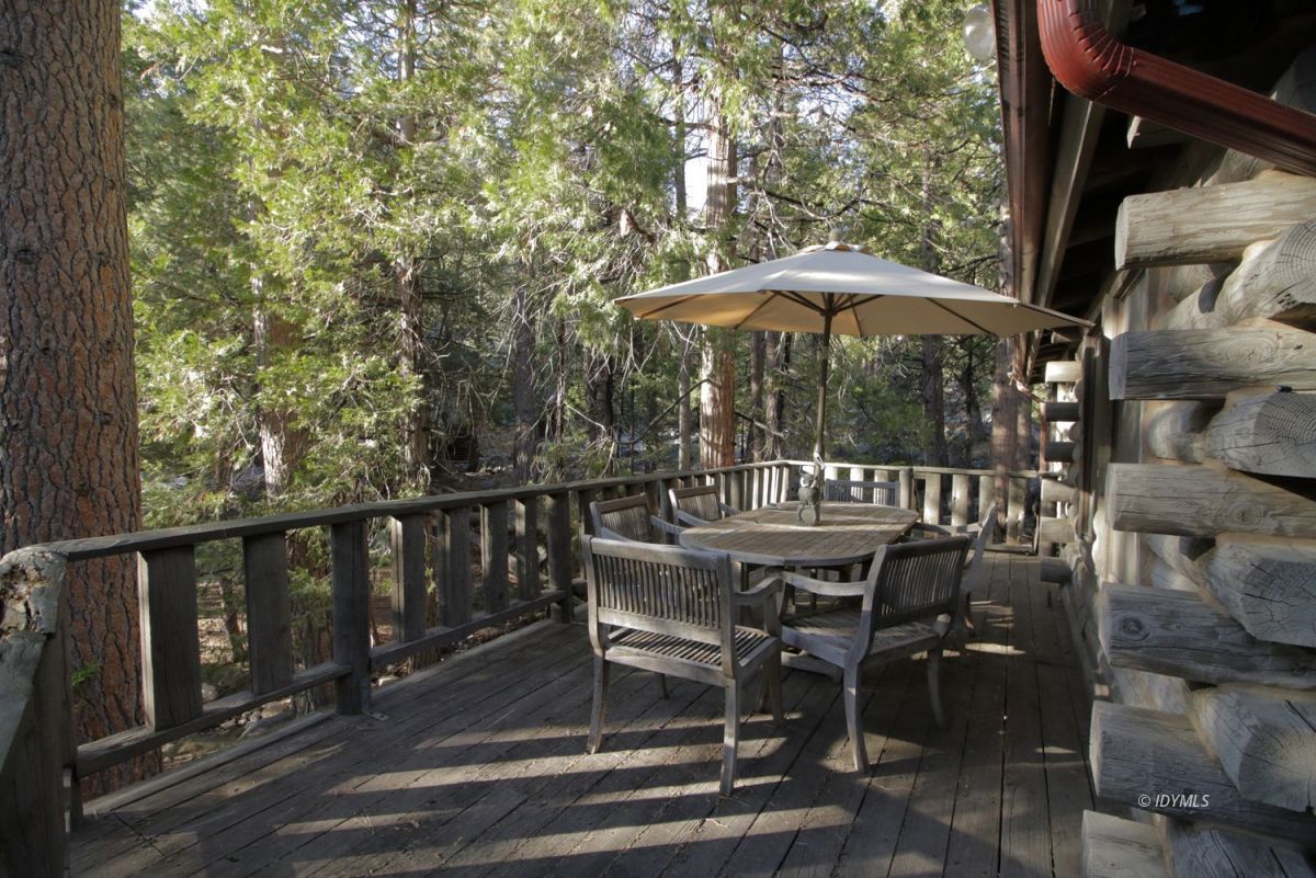 24745 Fern Valley Road Idyllwild, CA 92549 - Photo 45 of 48 a view of a chair and table on the deck