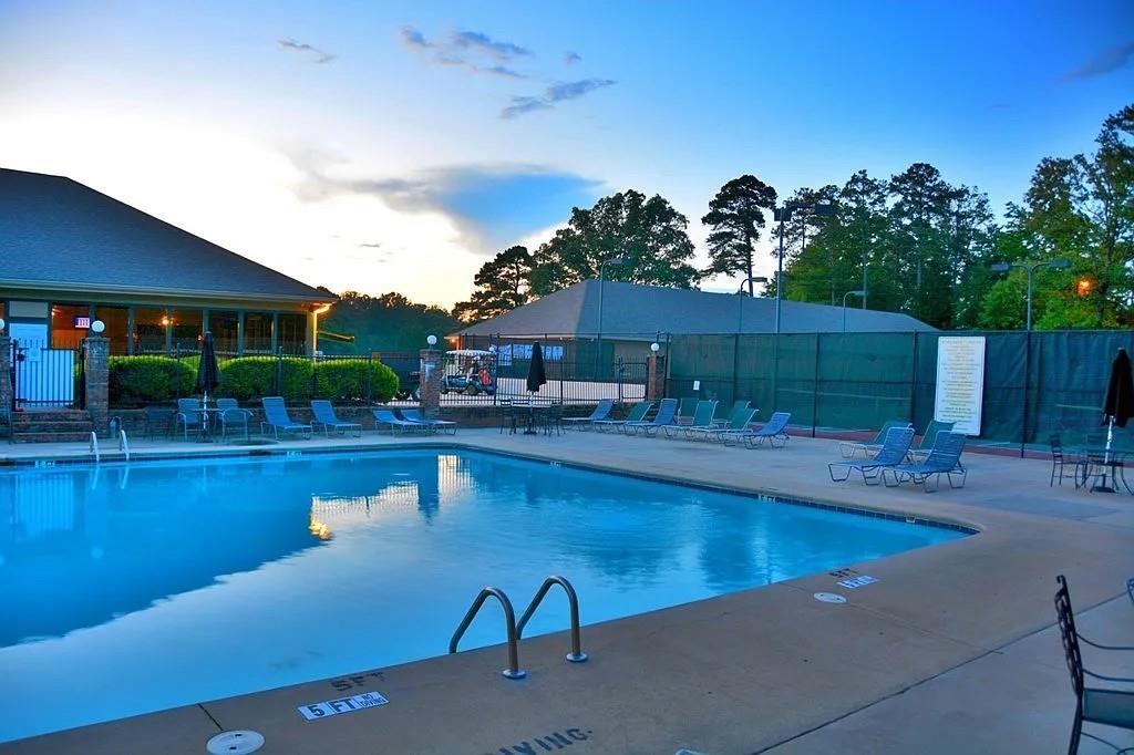 6047 Belle Meade Drive Villa Rica, GA 30180 - Photo 16 of 17 a swimming pool with outdoor seating and yard