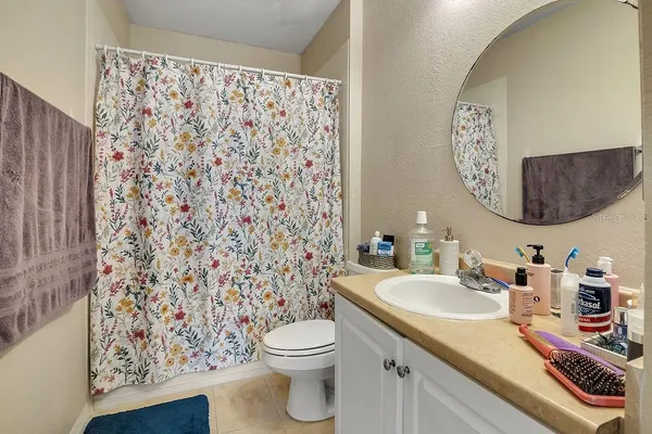 a bathroom with a sink toilet and a mirror