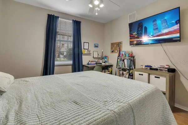 a bedroom with a bed and furniture