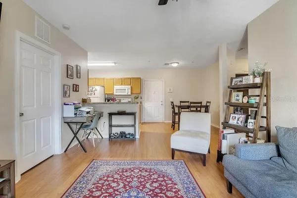 a living room with furniture and a rug