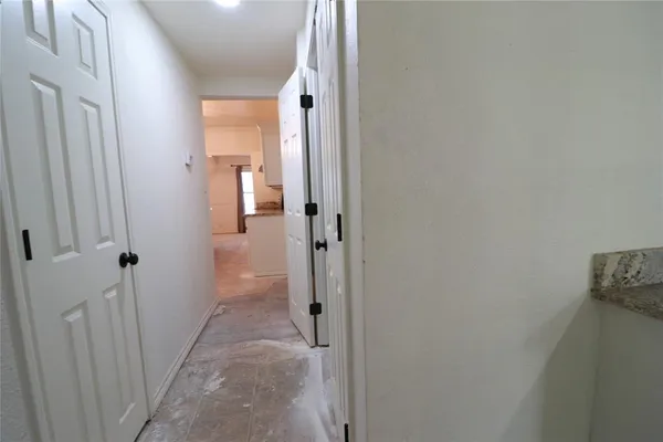 a view of a hallway with a fireplace