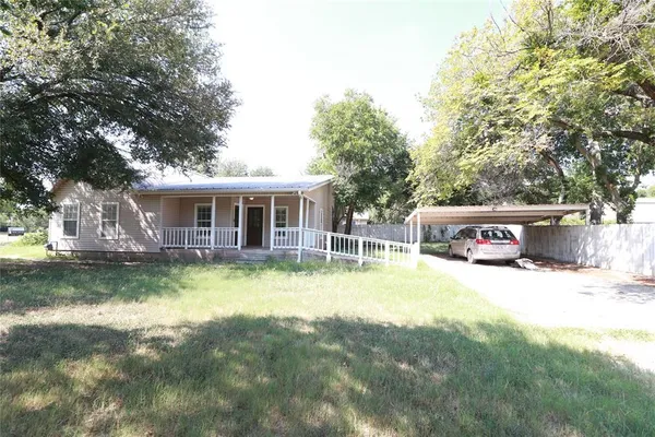 a view of house with outdoor space and swimming pool