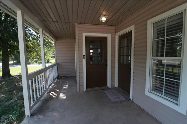 a view of backyard with porch
