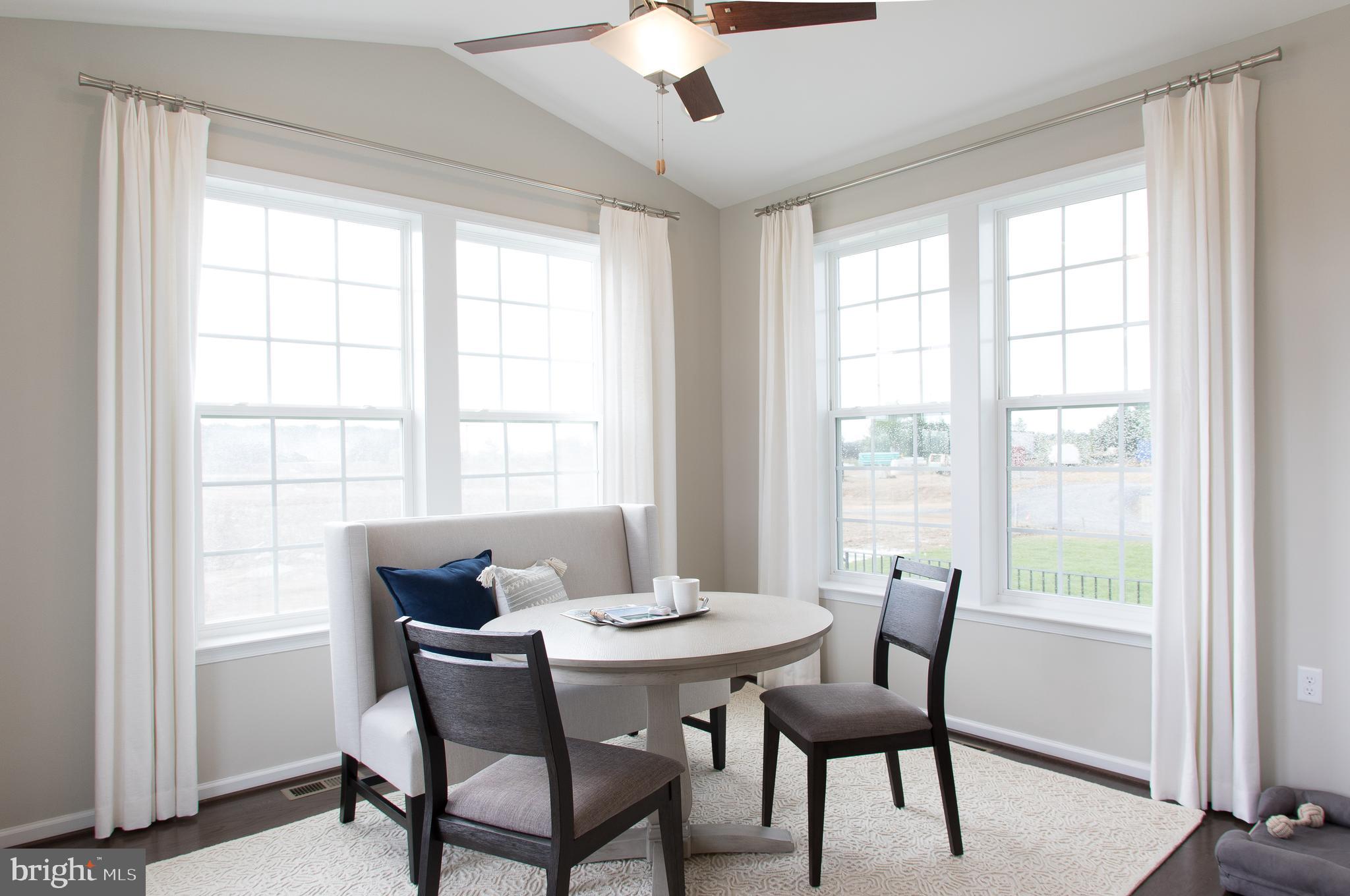 Tbb Tbb Marquee Farm Road, Unit CYPRESS Charles Town, WV 25414 - Photo 7 of 30 a view of a dining room with furniture window and outside view