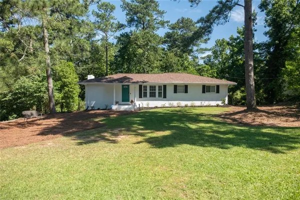 a view of a house with a big yard