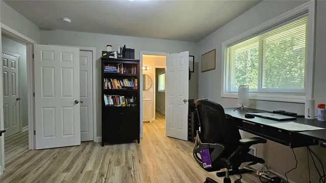 a bedroom with a bed and window