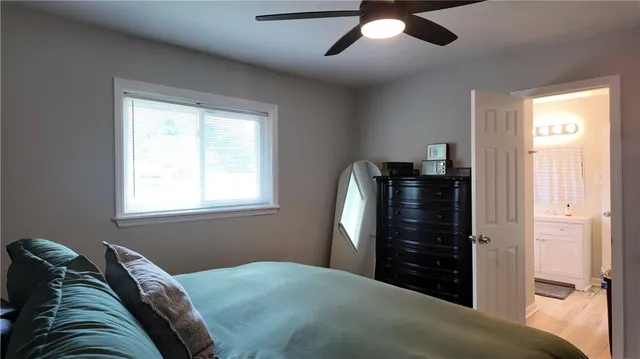 a bathroom with a toilet a sink and a mirror