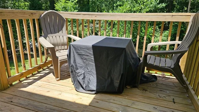 a view of a swimming pool with an outdoor space and seating area