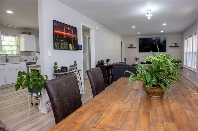 a kitchen with stainless steel appliances a refrigerator sink and microwave