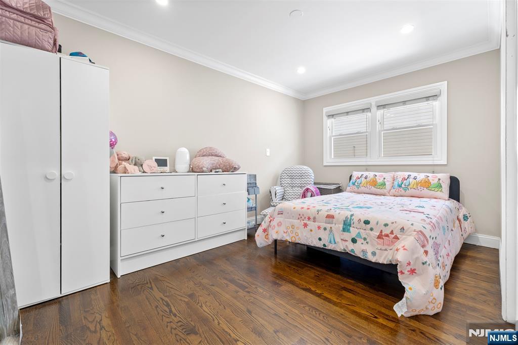 112 Garibaldi Avenue Lodi, NJ 07644 - Photo 13 of 31 a bedroom with a bed and a dresser