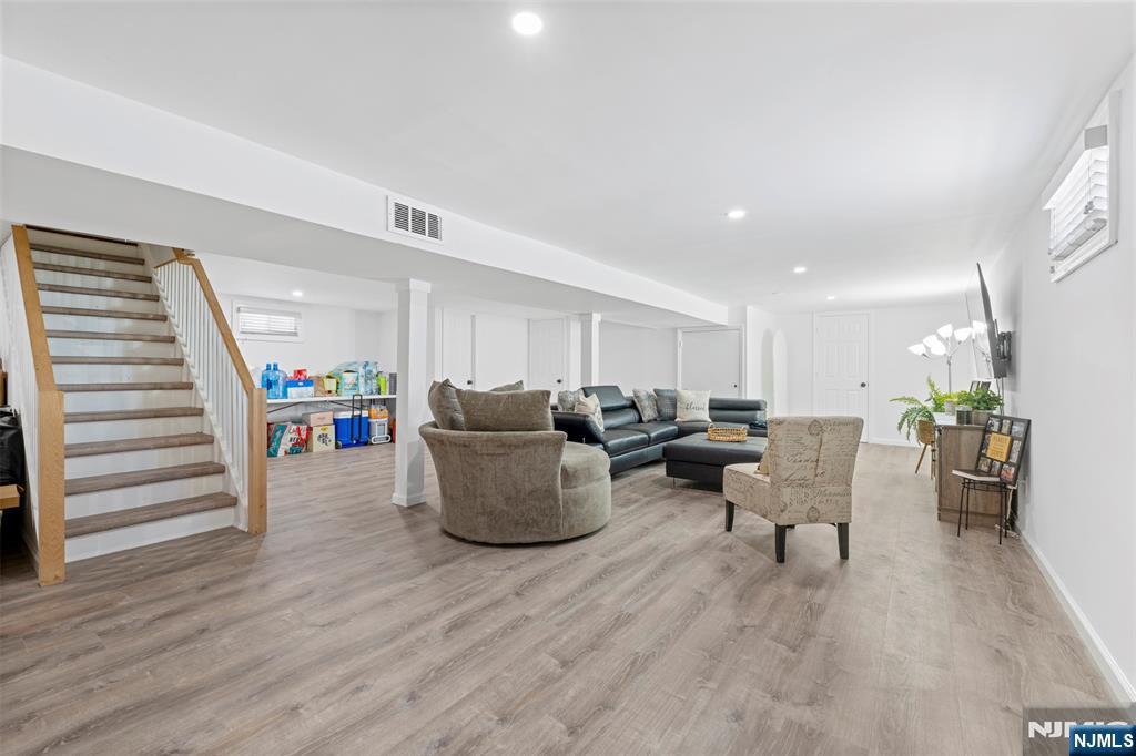112 Garibaldi Avenue Lodi, NJ 07644 - Photo 14 of 31 a living room with furniture and a wooden floor
