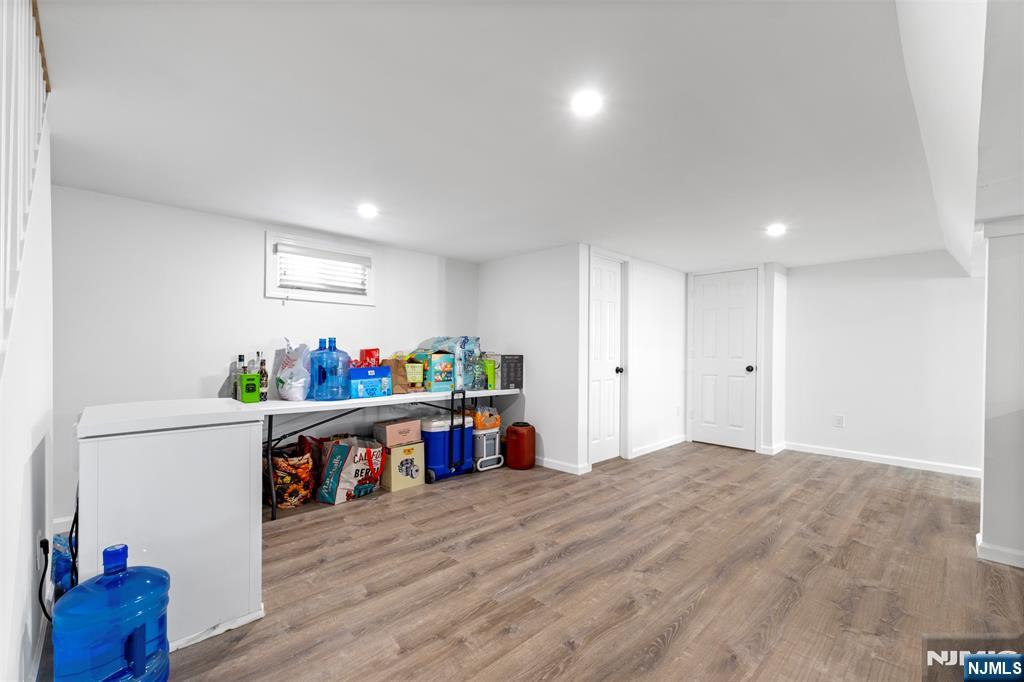 112 Garibaldi Avenue Lodi, NJ 07644 - Photo 18 of 31 a view of an empty room and wooden floor