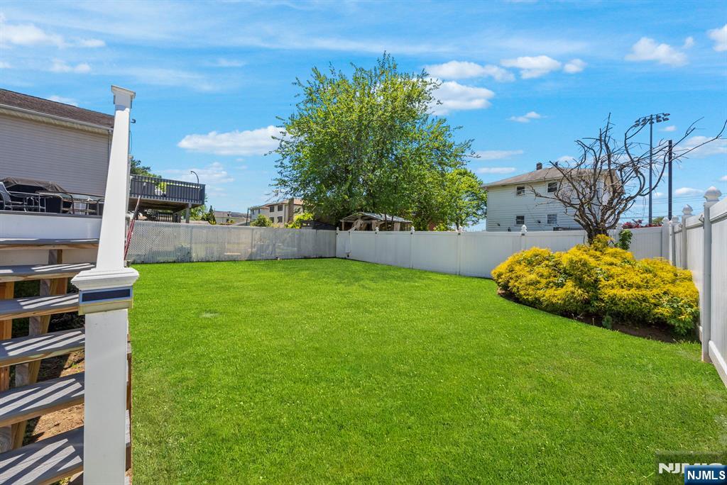 112 Garibaldi Avenue Lodi, NJ 07644 - Photo 20 of 31 a view of yard with swimming pool and green space