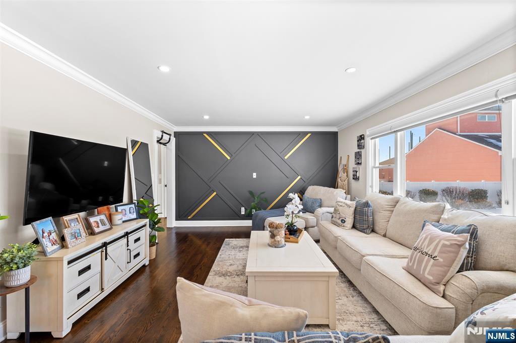 112 Garibaldi Avenue Lodi, NJ 07644 - Photo 5 of 31 a living room with furniture and a flat screen tv
