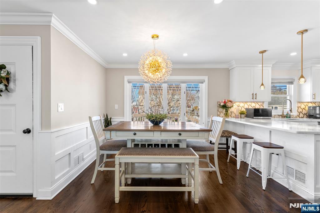 112 Garibaldi Avenue Lodi, NJ 07644 - Photo 6 of 31 a view of kitchen with dining table and chairs