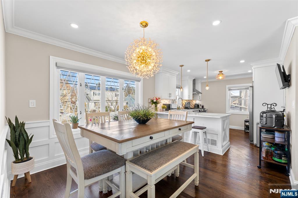112 Garibaldi Avenue Lodi, NJ 07644 - Photo 7 of 31 a view of a dining room with furniture wooden floor and chandelier