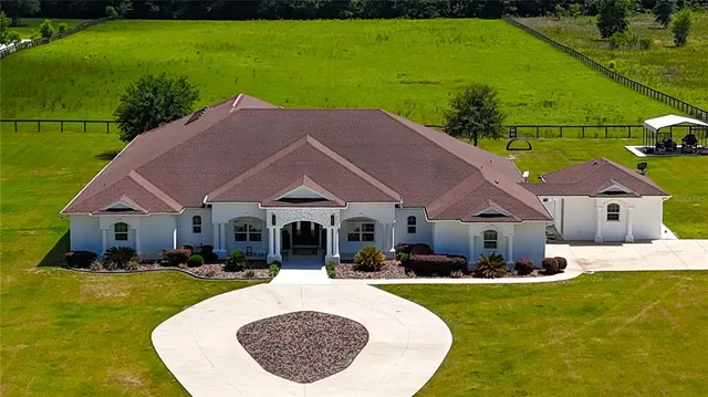 a view of a house with a swimming pool