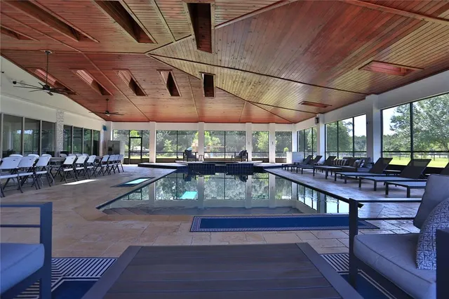 a view of a swimming pool with a patio