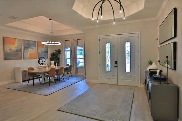 a view of a livingroom with furniture and entryway