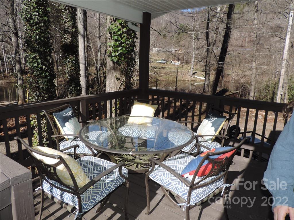 3284 Lake Logan Road Canton, NC 28716 - Photo 17 of 44 an outdoor living area with furniture and a potted plant