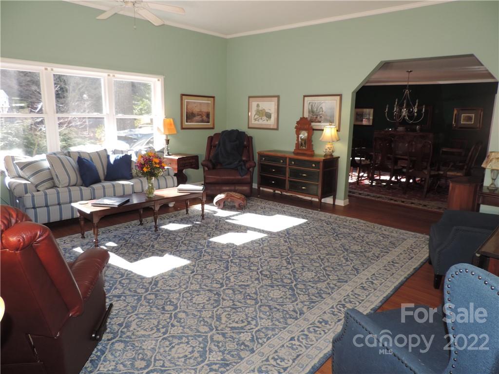 3284 Lake Logan Road Canton, NC 28716 - Photo 2 of 44 a living room with furniture and a flat screen tv