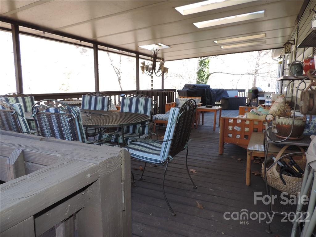 3284 Lake Logan Road Canton, NC 28716 - Photo 25 of 44 a view of a dining room with furniture window and outside view
