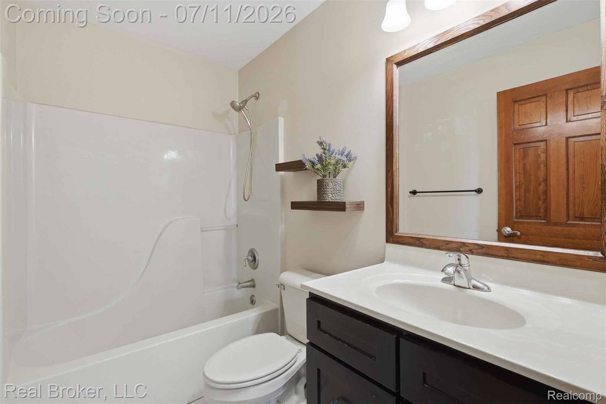 1050 West Brocker Road Metamora, MI 48455 - Photo 26 of 55 Bathroom featuring a white tub-shower combination with a handheld showerhead