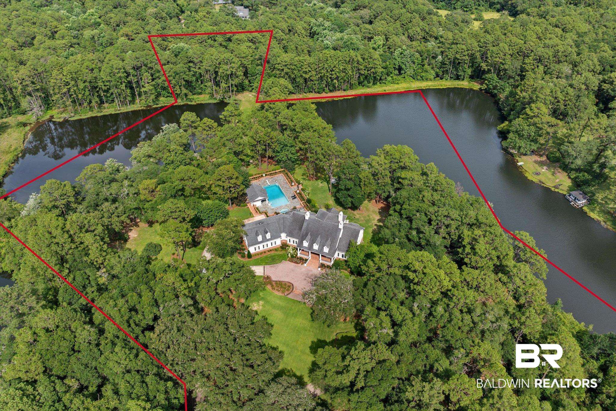 8561 Dawes Lake Road Mobile, AL 36619 - Photo 59 of 63 Aerial view of property's location with property boundaries highlighted and a nearby body of water