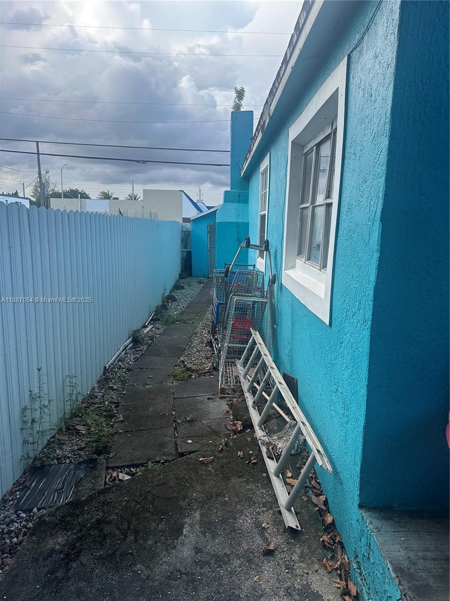 390 Northeast 166th Street Miami, FL 33162 - Photo 8 of 10 a view of a room with wooden floor