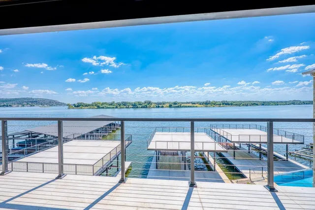 a view of a balcony with chairs